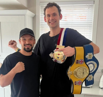 Holding all the champion belts World Champion, Commonwealth, United Kingdom and British of Brad Stanton after massage.